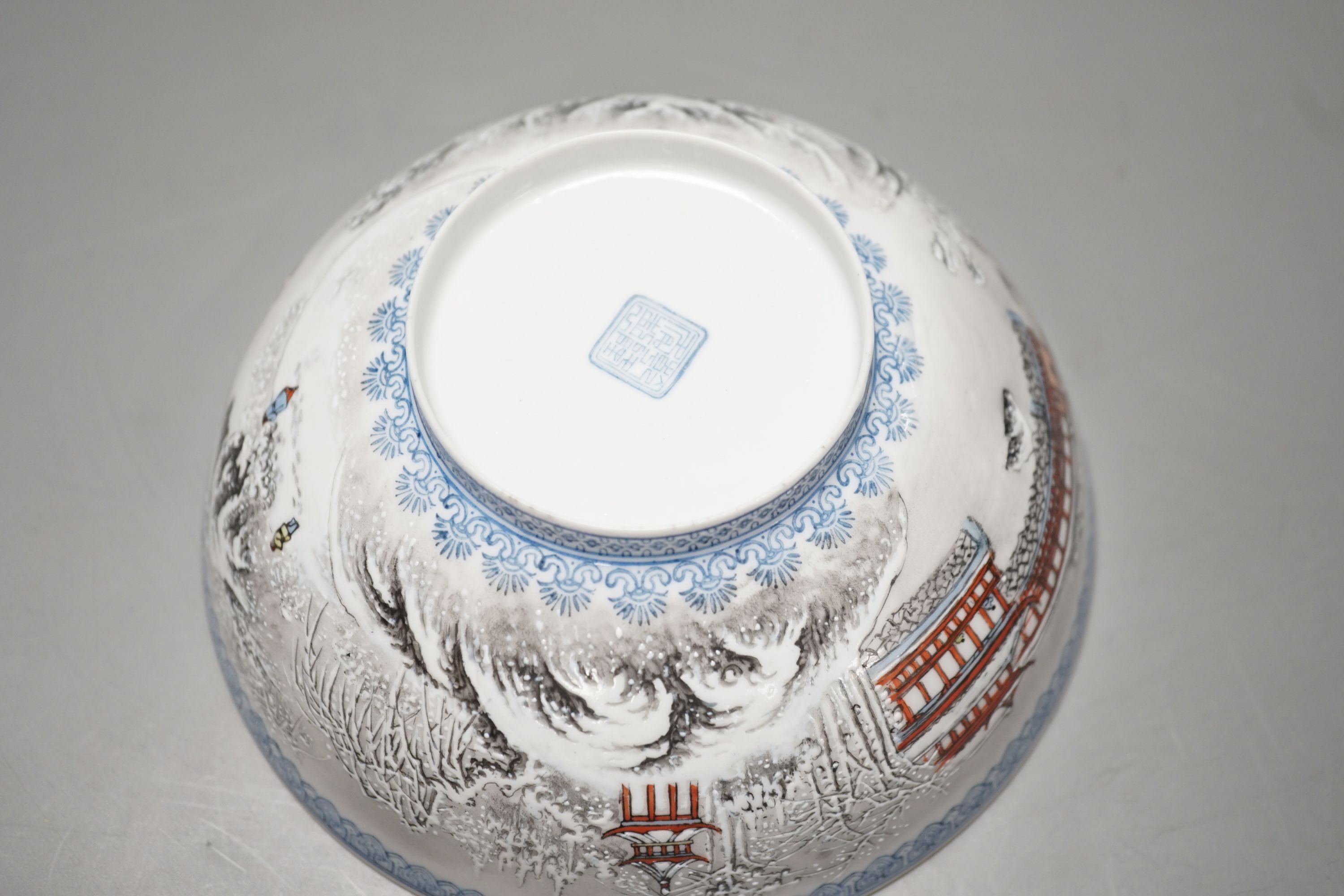 A Chinese enamelled porcelain snow scene dish, diameter 31cm, and a similar smaller eggshell bowl